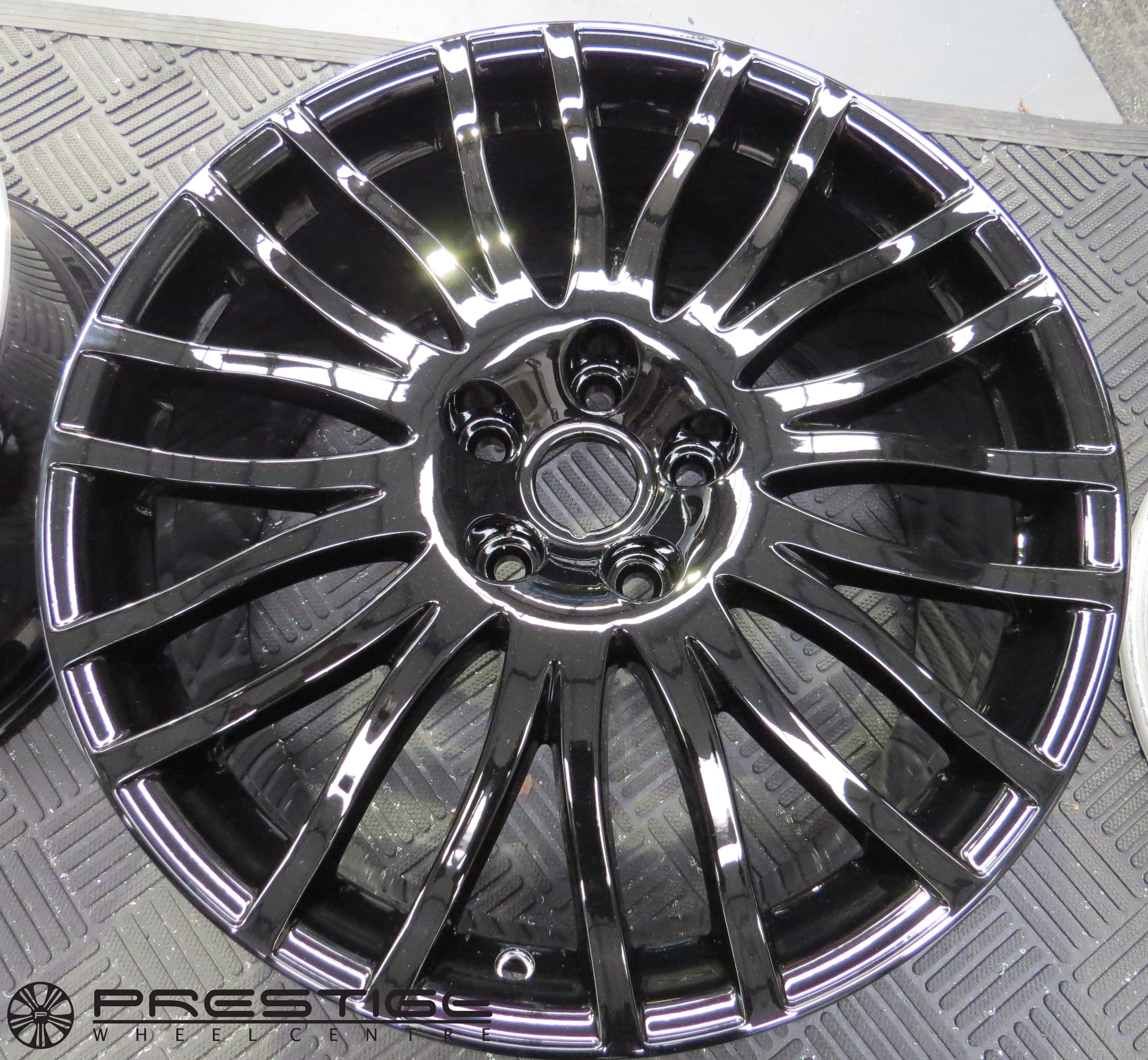 Aston Martin wheel refurbishment DB9 19″ 20 spoke diamond turned wheels